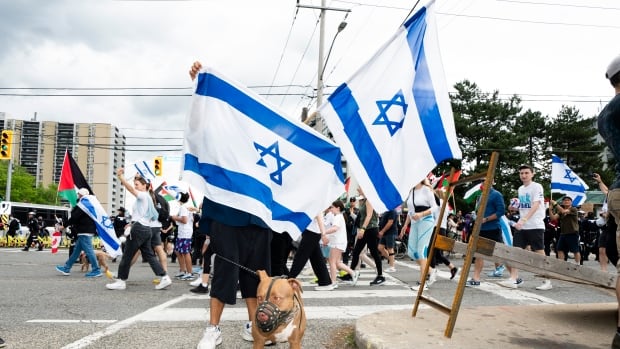 Torontonians gather to mark anniversary of Oct. 7 attack, and the grief, fury of the aftermath | CBC News